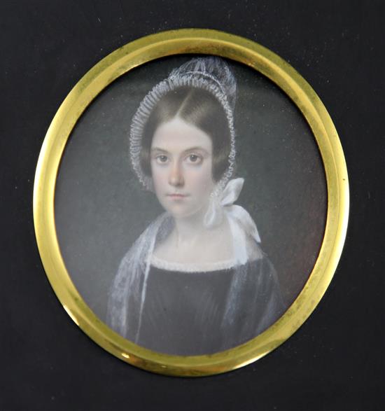 English School c.1870 Miniature of a young lady wearing a lace bonnet, tondo, 2.75in.